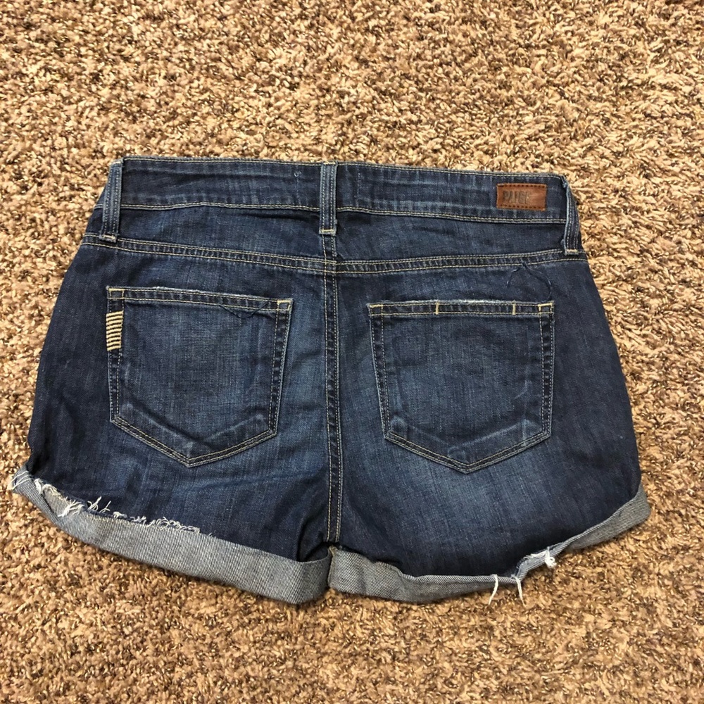 Slightly distressed dark blue denim short shorts